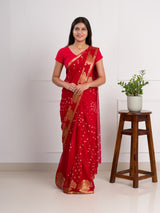 A red saree with gold patternsin Georgette Bandhani Style Saree