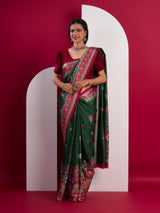 A green saree with a colorful borderin Dola Silk KalamkariStyle