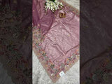A purple tissue silk saree with Bollywood-style sequence embroidery work, suitable for traditional and party wear.