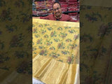 A yellow and blue floral patterned Tussar silk saree with Banarasi weaving.