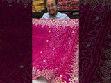 A pink saree with Bandhej pattern and Gotapatti work
