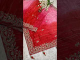 red saree with golden and silver embellishments and cutdana work, showcasing a traditional and festive design.