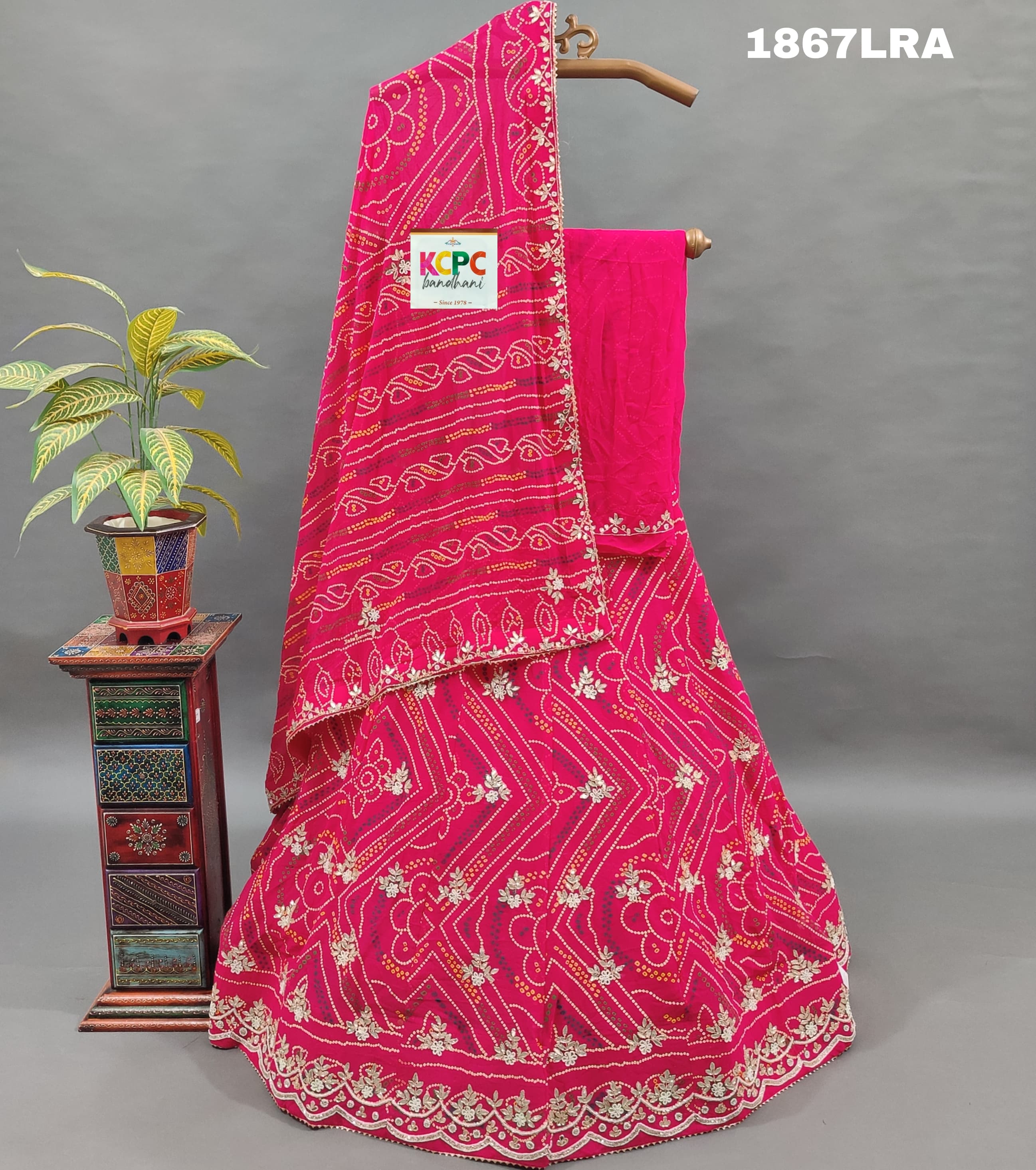 A pink georgette bandhej lehenga with cutdana gotapatti work