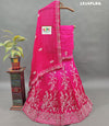 A pink lehenga with white cutdana beads work and mirror