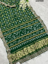 A green and gold pure Gaji silk bandhani gharchola saree with floral patterns and gota patti