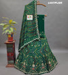 A traditional green lehenga with gotapati work