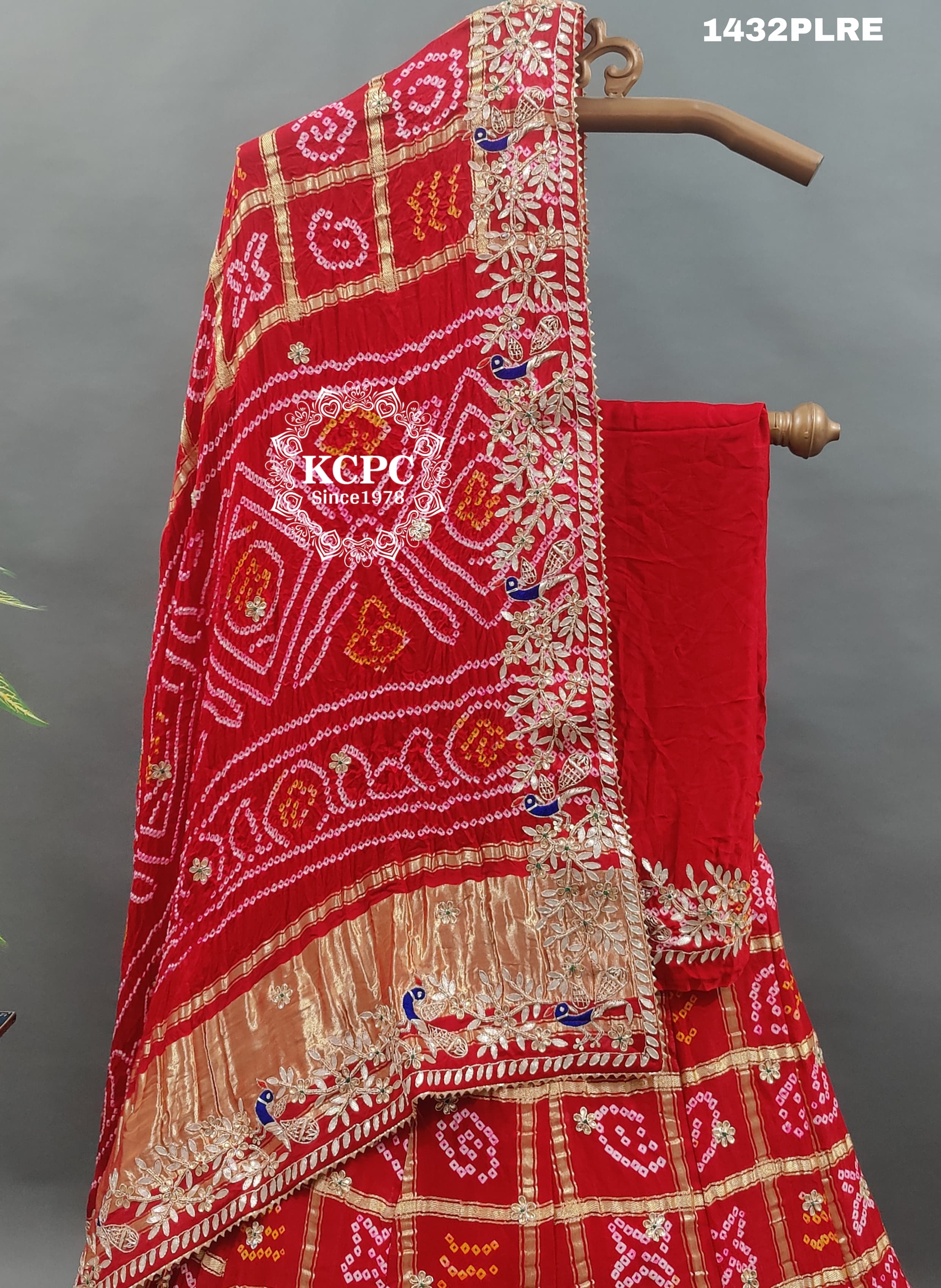 A red and multicolor traditional Gaji silk lehenga with zardozi work