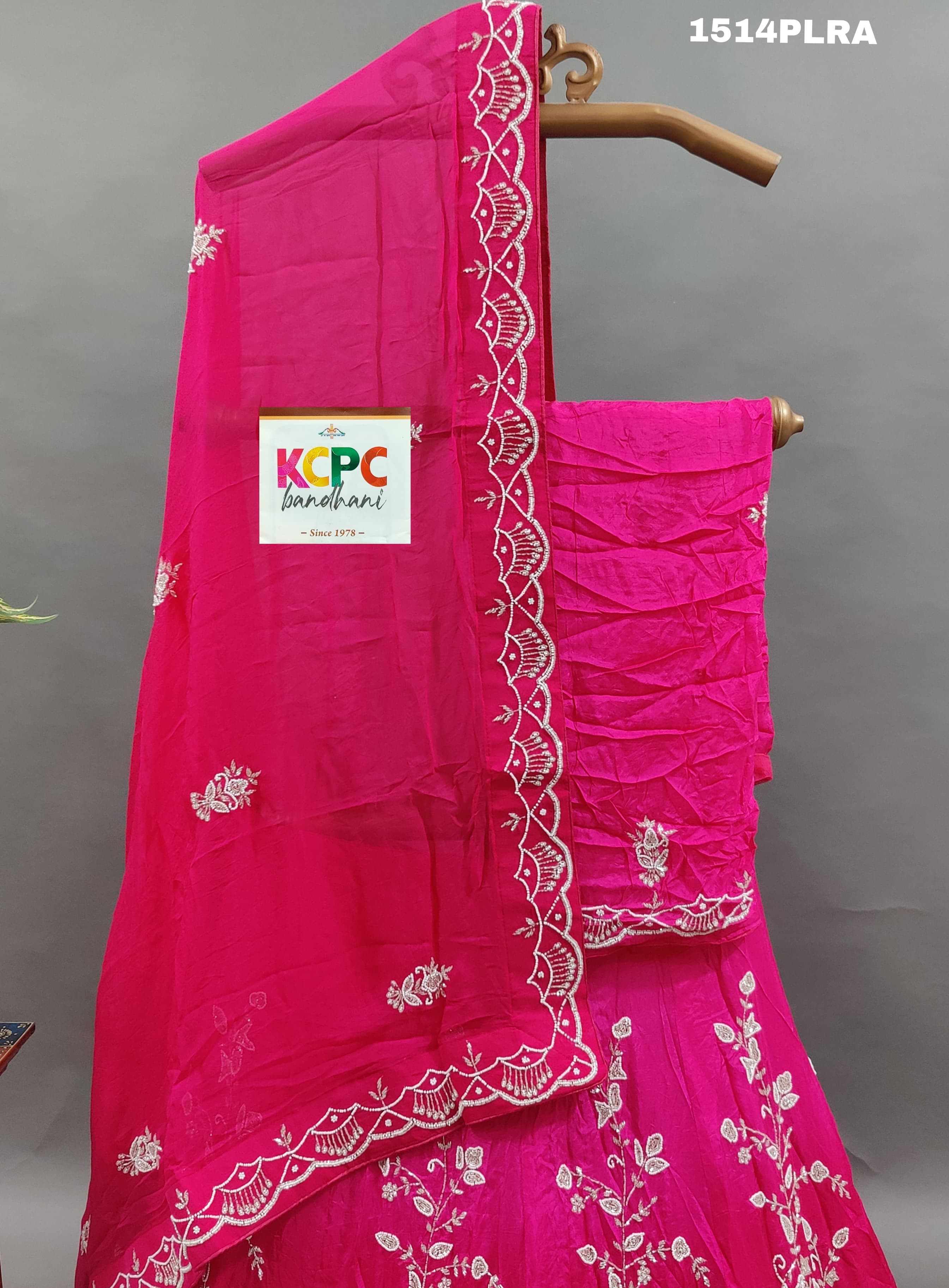 A pink lehenga with white cutdana beads work and mirror