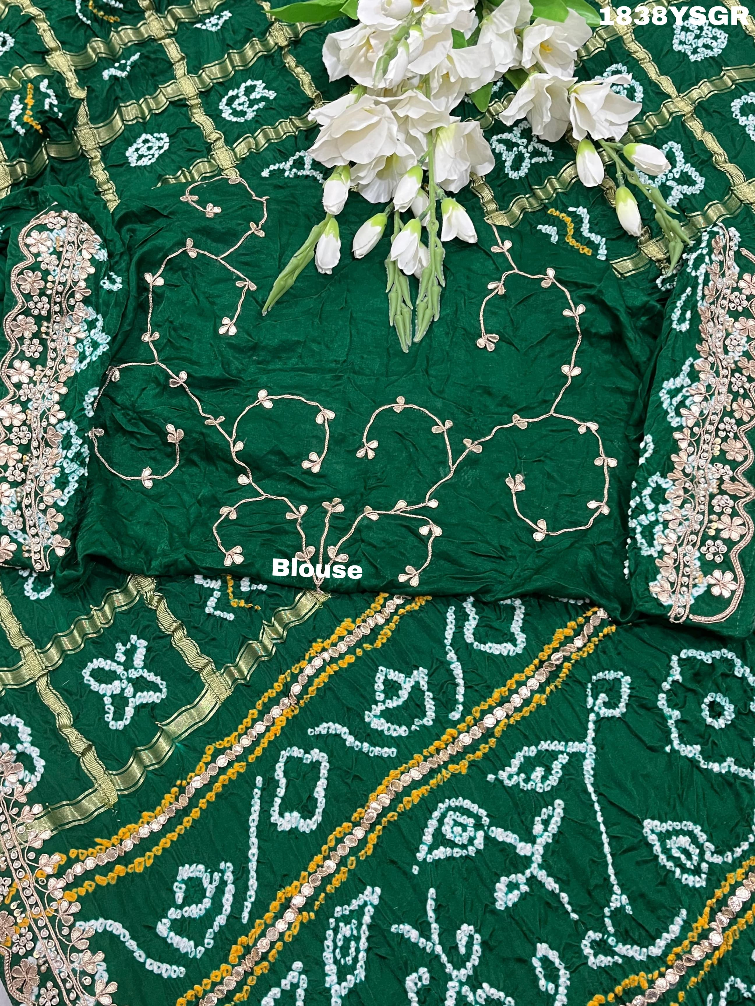 A green and gold pure Gaji silk bandhani gharchola saree with floral patterns and gota patti