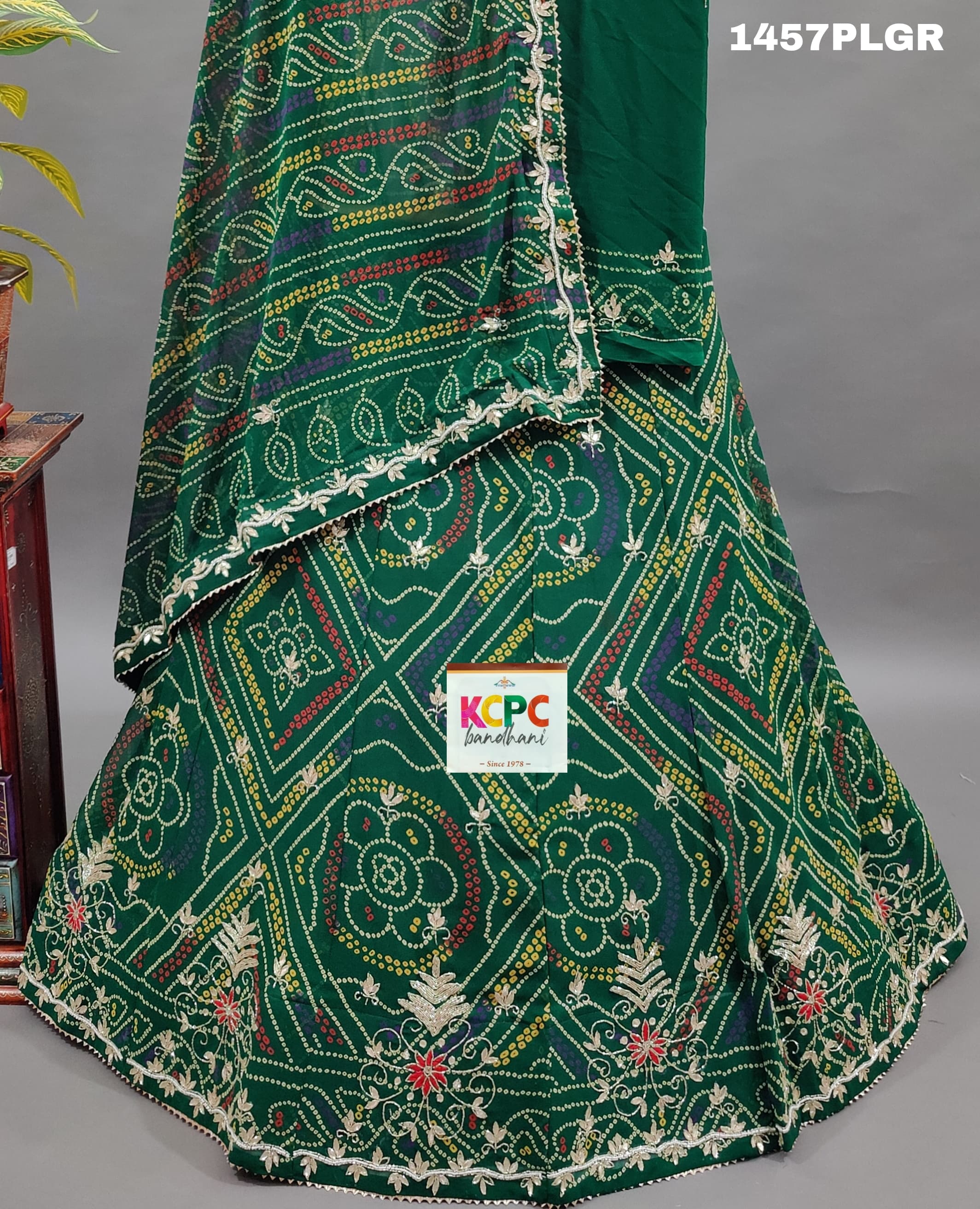 A traditional green lehenga with gotapati work