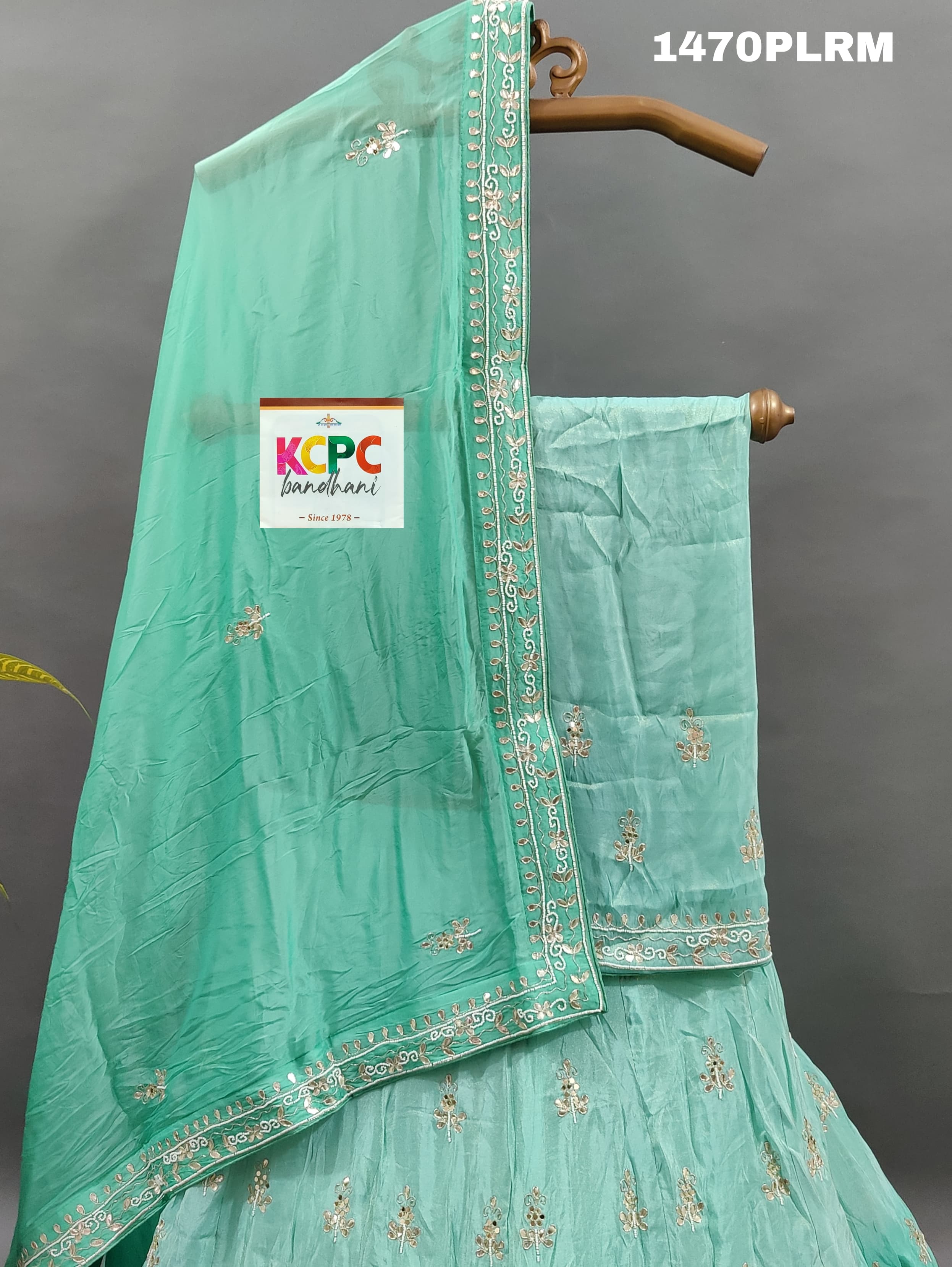 A green H O silk double shade heavy cutdana mirror work lehenga