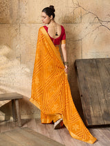 A yellow bandhani style chiffon georgette saree with a red blouse piece under 1000