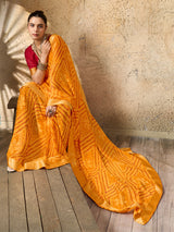 A yellow bandhani style chiffon georgette saree with a red blouse piece under 1000
