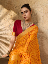 A yellow bandhani style chiffon georgette saree with a red blouse piece under 1000