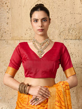 A yellow bandhani style chiffon georgette saree with a red blouse piece under 1000
