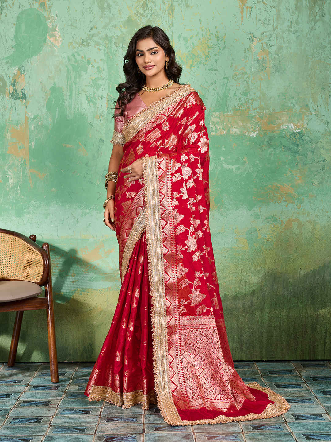 Woman in a red saree with gold borderTissue silk Banarasi Style 