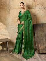 A green bandhani style chiffon georgette saree with a golden border and a matching green blouse piece, 
