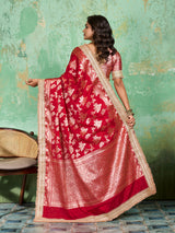 Woman in a red saree with gold borderTissue silk Banarasi Style 