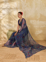 A blue colour geometric patterned saree with bandhani style dots under 500