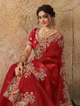 A red saree with floral embroidery