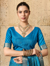 A blue chiffon georgette saree with bandhani print, featuring a sky blue color and decorative patterns, paired with a blue blouse.