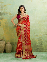  Banarasi silk saree with heavy zari work in orange and red color, with a traditional gharcholastyle 
