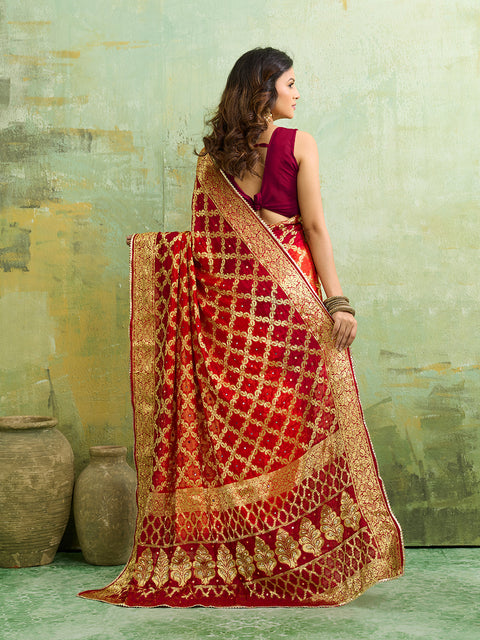  Banarasi silk saree with heavy zari work in orange and red color, with a traditional gharchola  style 