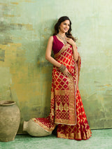  Banarasi silk saree with heavy zari work in orange and red color, with a traditional gharcholastyle 