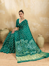  A traditional saree with a bandhani pattern in teal color,