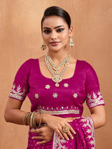 A pink modal silk saree with bandhani pattern and gotapatti work