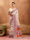  off-white saree with a floral and geometric pattern, featuring a heavy border and a small floral design on the fabric.