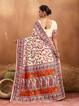  off-white saree with a floral and geometric pattern, featuring a heavy border and a small floral design on the fabric.