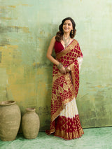 Banarasi silk saree with heavy zari work and a gharchola pattern in white and red colors