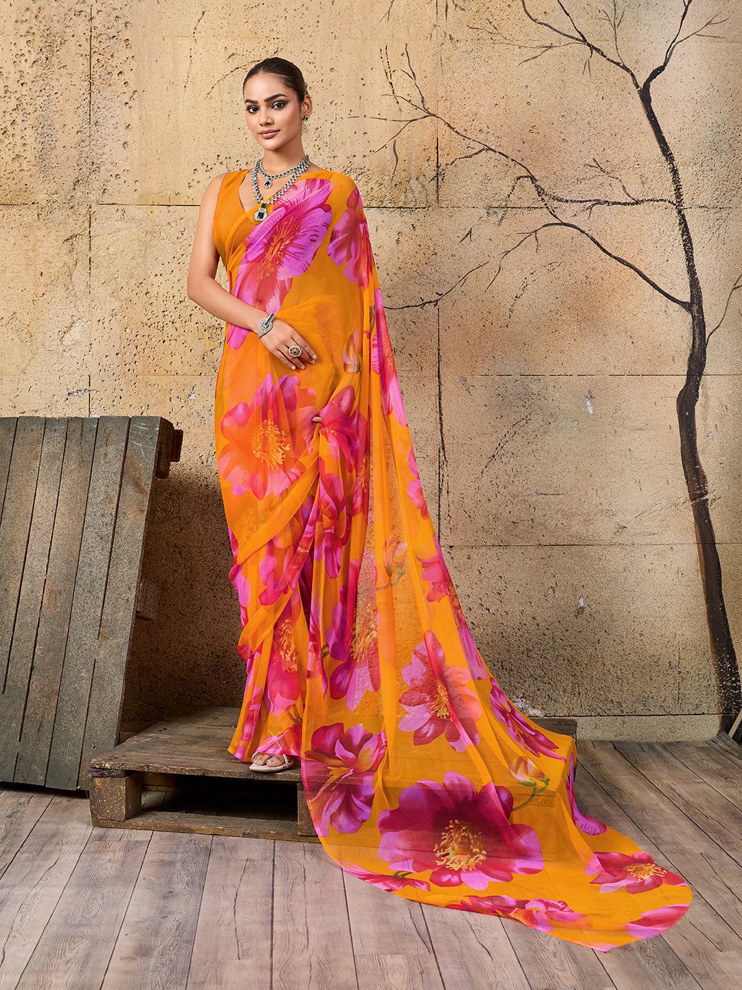 A vibrant orange and pink floral sareeGeorgette Flower Printed Style 