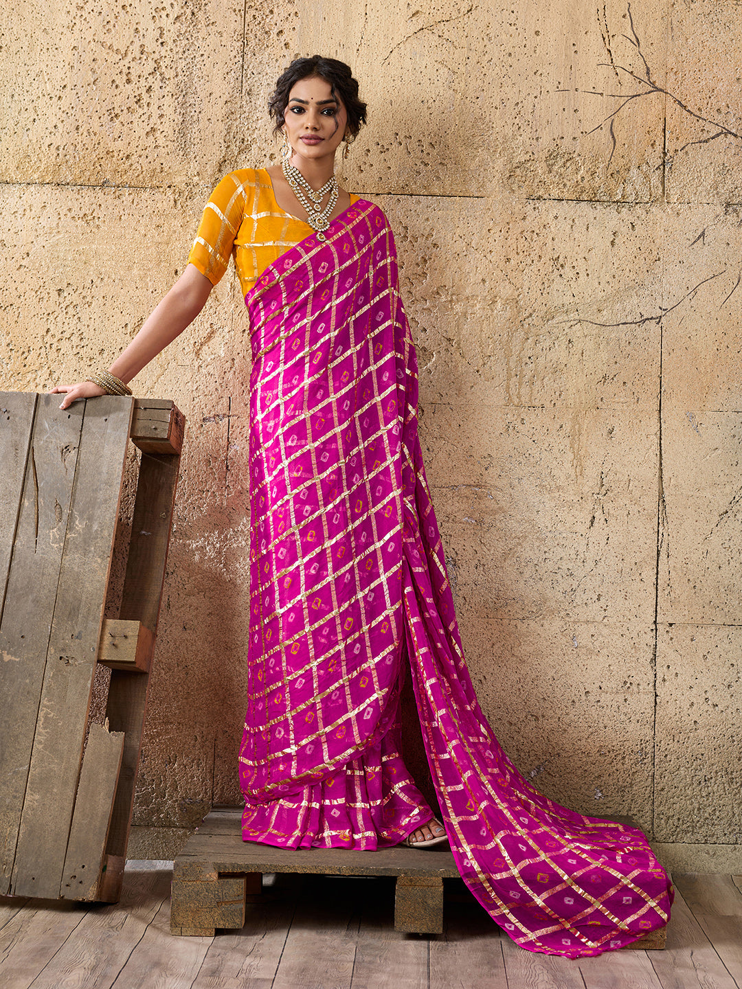 A party wear saree in Rani colour