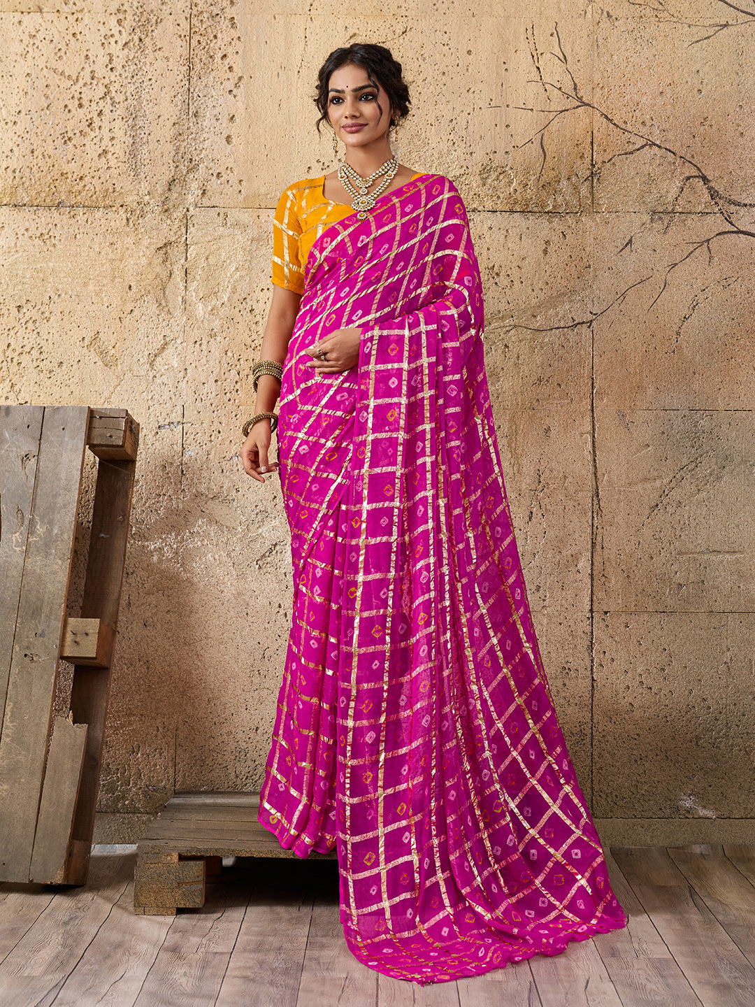 A party wear saree in Rani colour