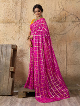 A party wear saree in Rani colour