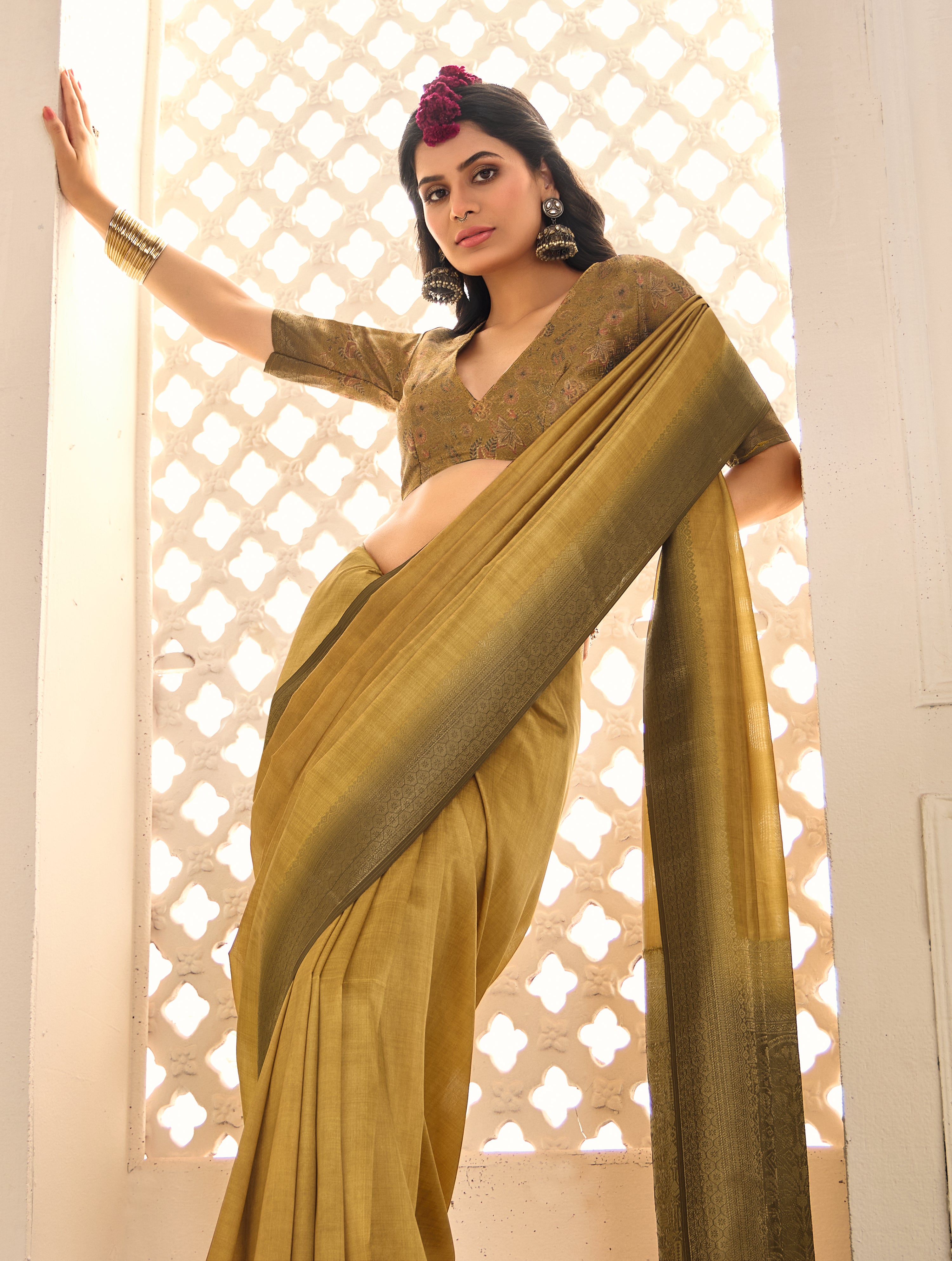 A gold and yellow tissue silk Banarasi style party wear saree 