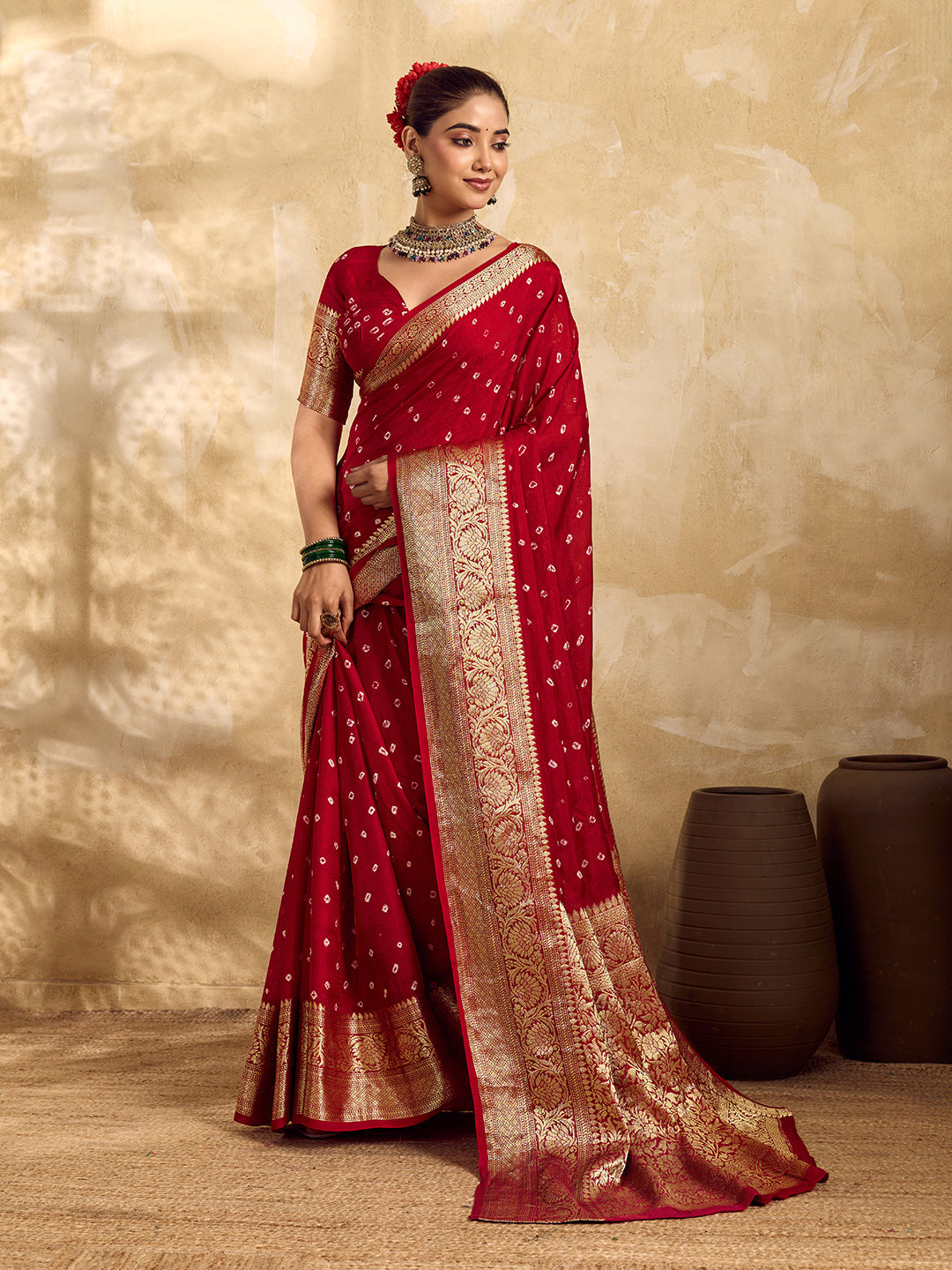  Buy red viscose silk saree with a bandhani pattern and zari border.