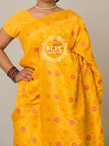 A yellow banarasi silk saree with floral patterns and zari embellishments.