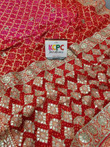A red georgette saree with gota patti