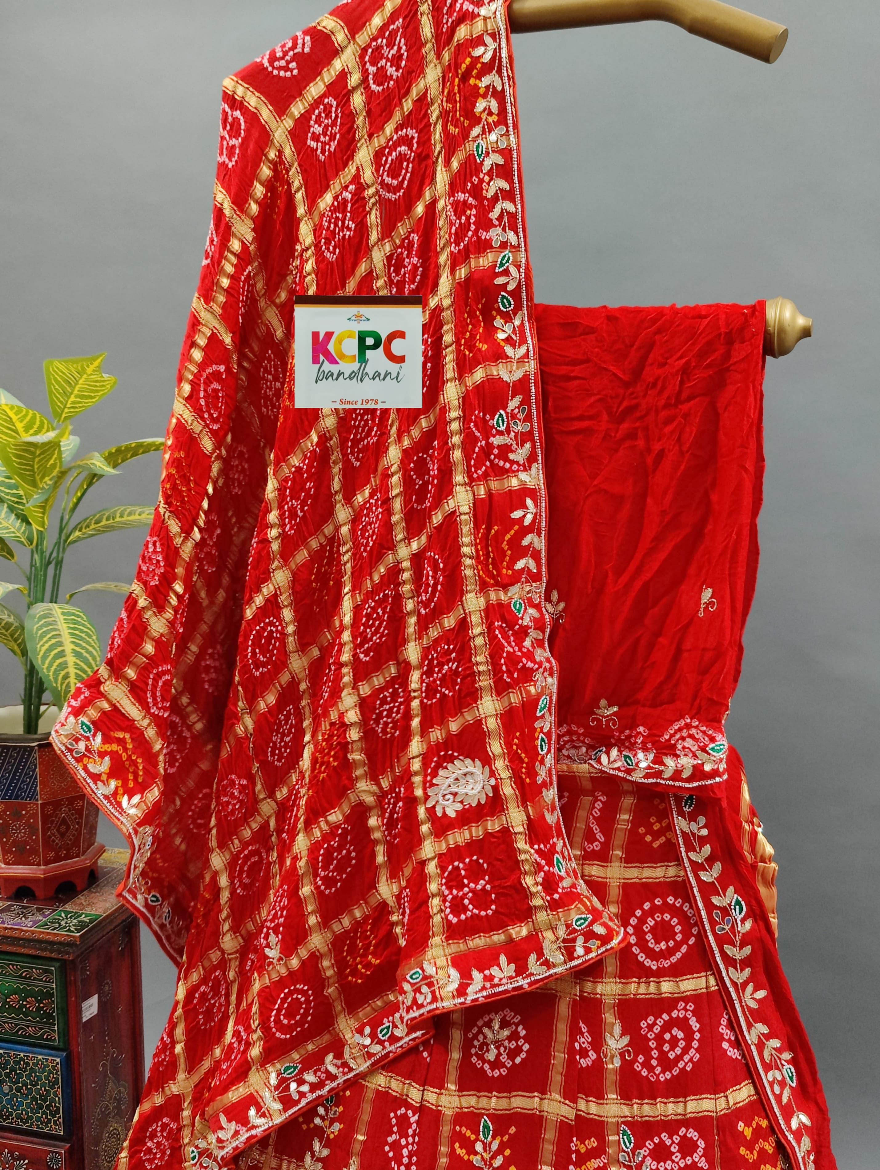  Gaji Silk Bandhani Ghatchola style lehenga in red colour