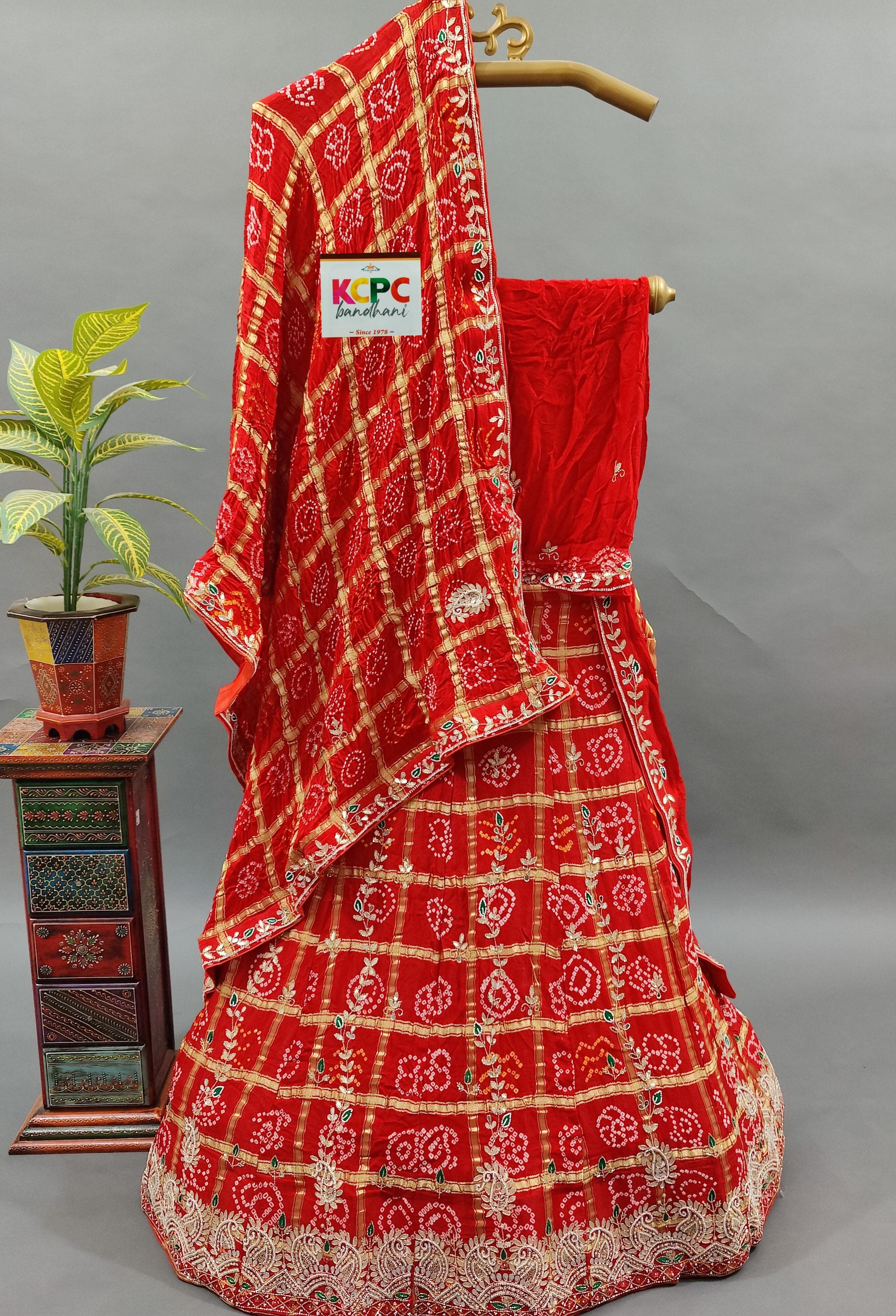  Gaji Silk Bandhani Ghatchola style lehenga in red colour
