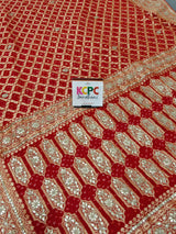 A red georgette saree with gota patti and neemzari bandhej 