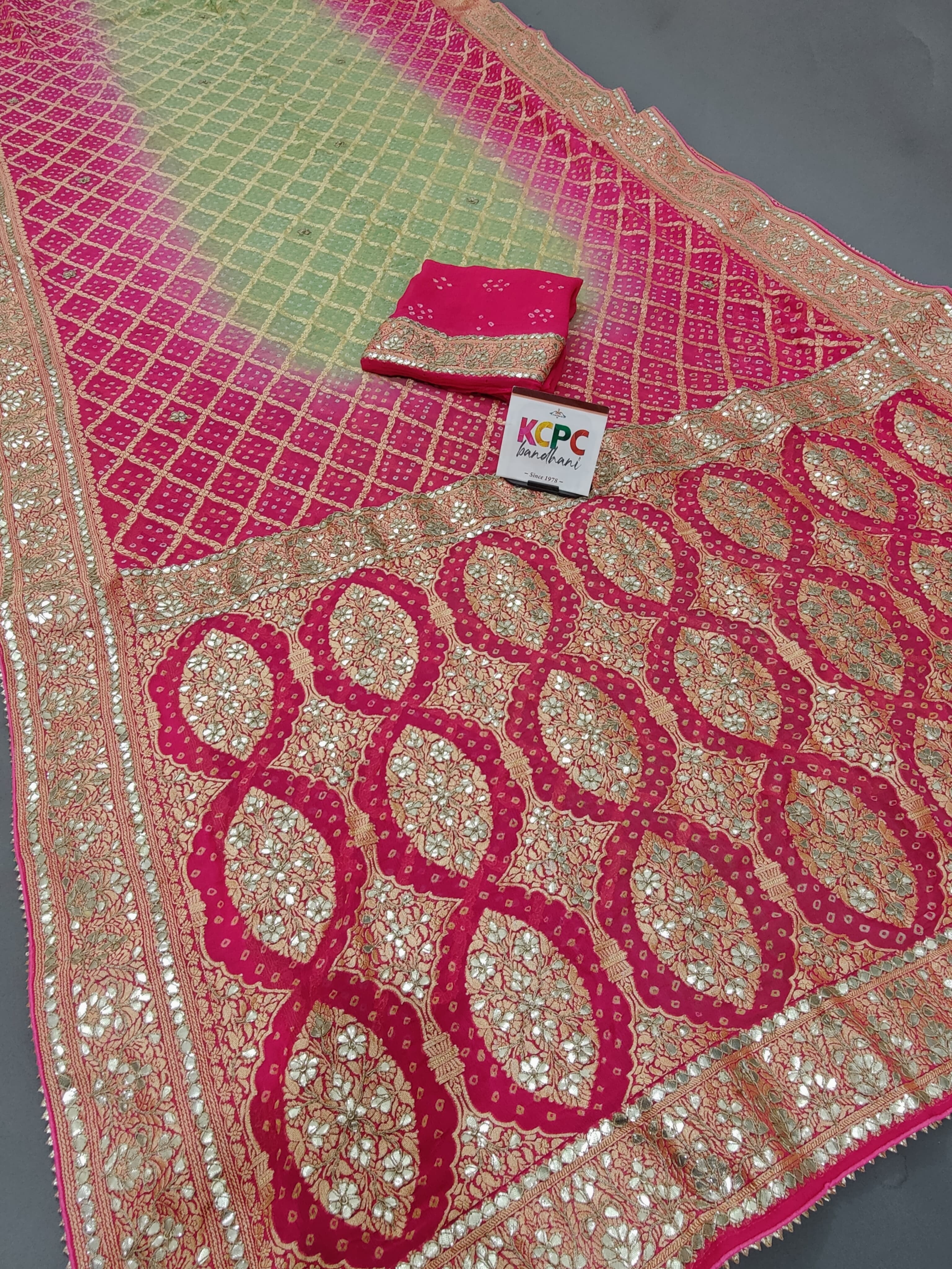 A pink georgette saree with floral and gota patti 