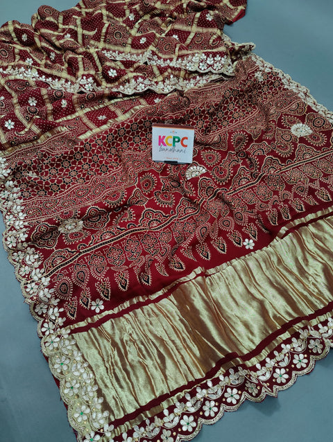 KcPc Pure Modal Gaji Silk Bandhani Ajrakh Handblock with Gotapatti Handwork Saree AMT