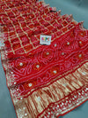 A red silk saree with gota patti work 