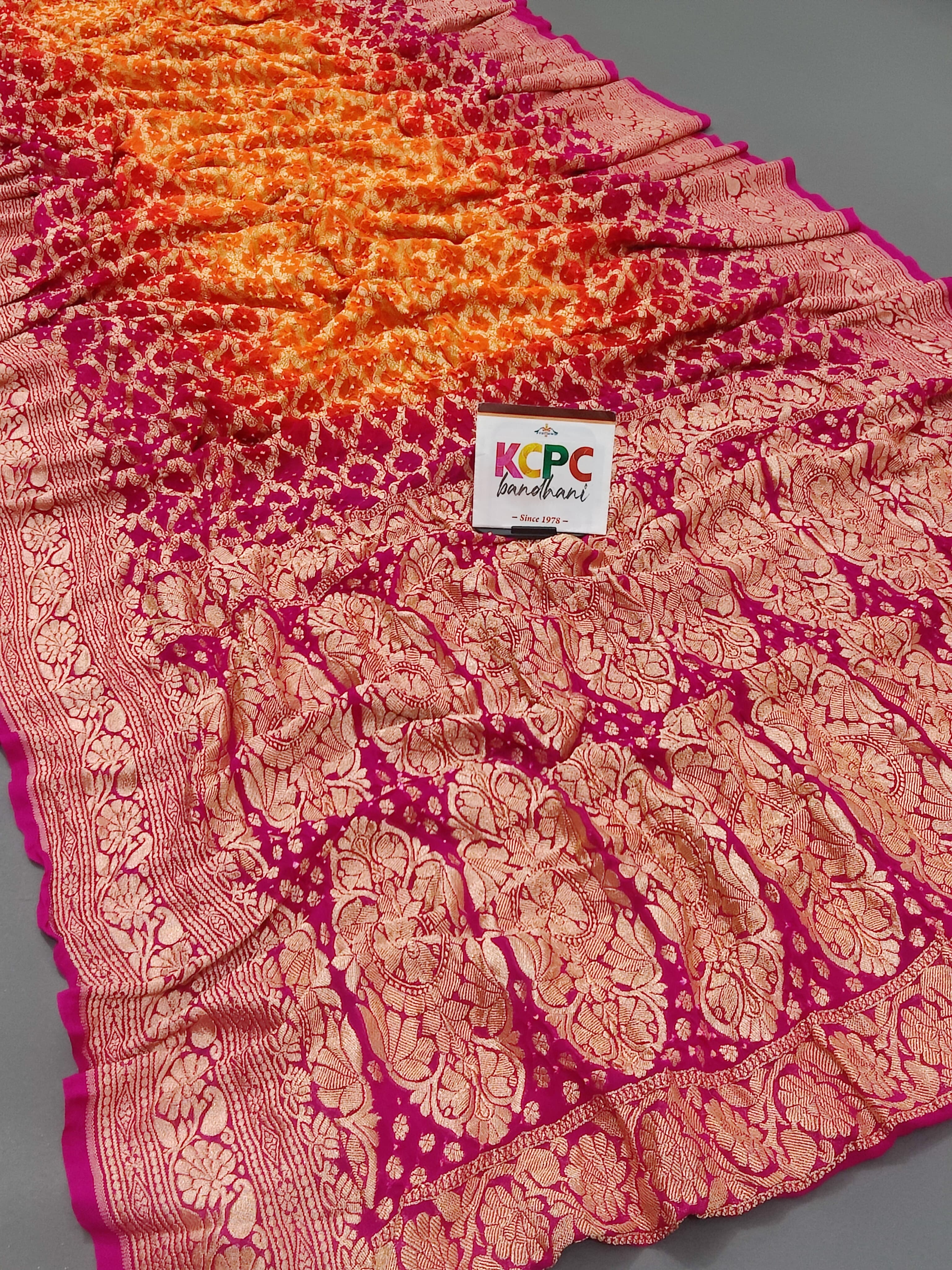 KcPc New Launch Pure Khaddi Georgette Upada Neemzari Bandhej SareeOrange Pink