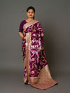 A purple Banarasi saree with floral patterns 