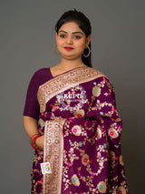 A purple Banarasi saree with floral patterns 